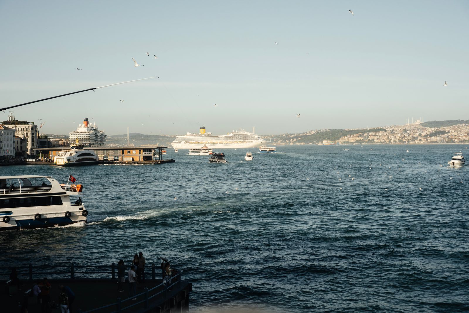 Cruise ships and ferries on the Bosphorus in Istanbul, a scene for weighing cruise line pros and cons